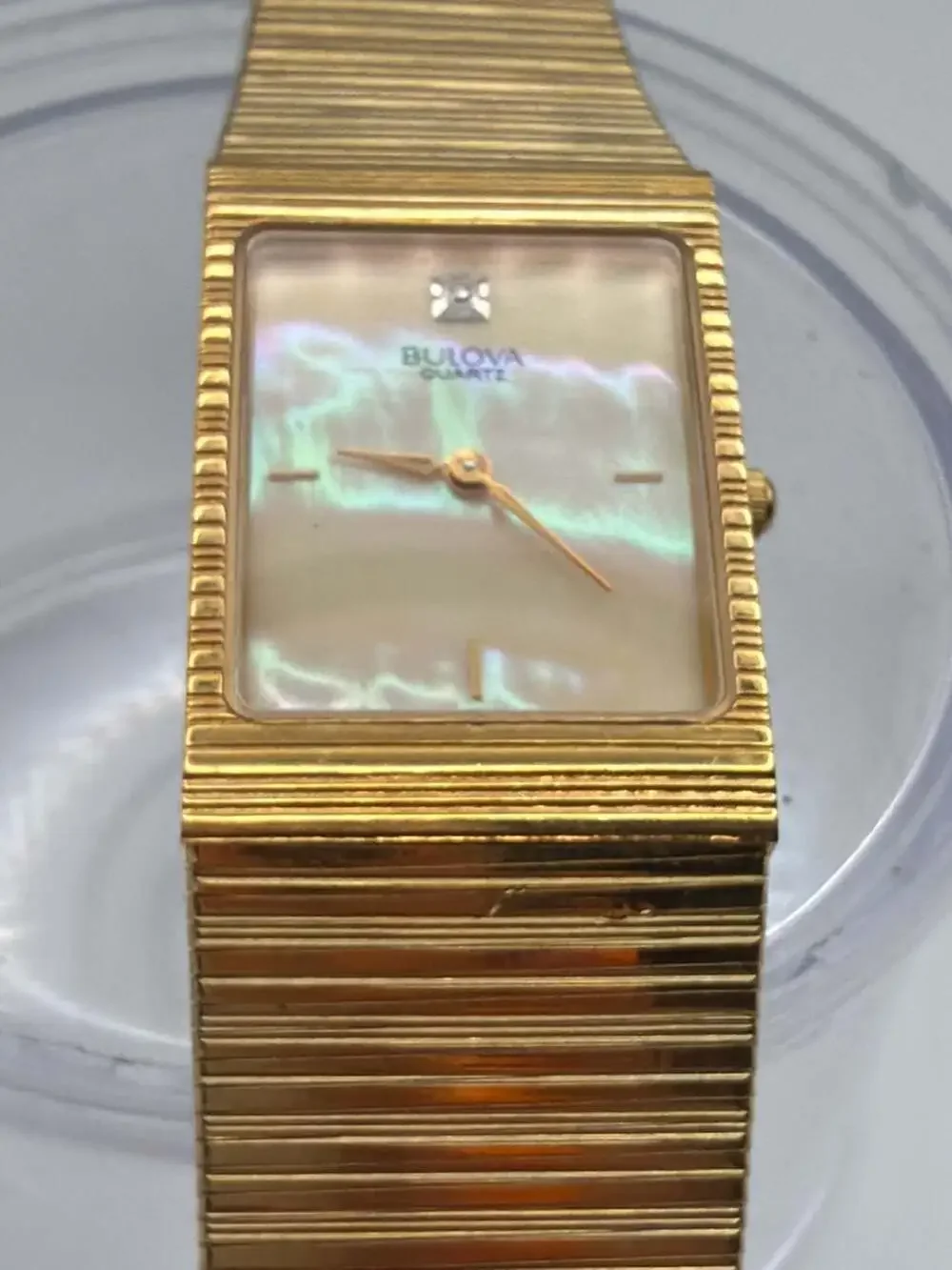 Bulova T1 Rectangular Mother-of-Pearl Quartz Watch with Gold-Tone Textured Strap